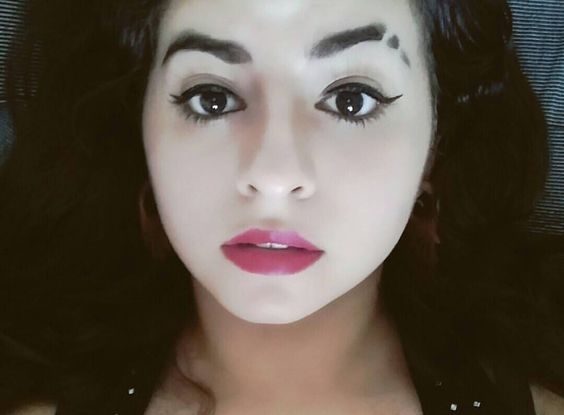 How do you slit your eyebrows permanently?