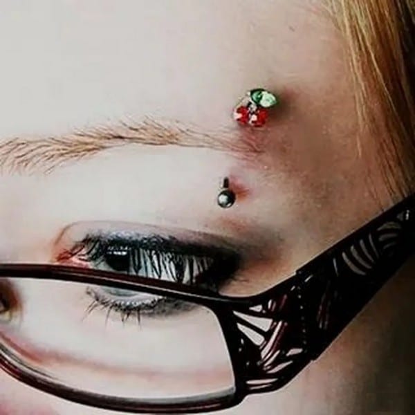 Eyebrow piercing with glasses